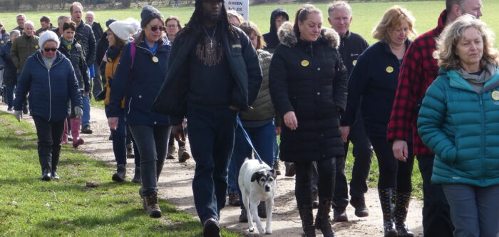 A group of people walking as a group action