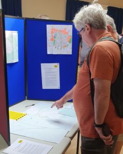 Public looking at maps and documents