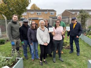 Volunteers receiving an award at a community garden