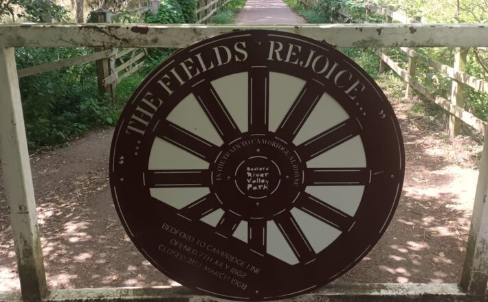 Gateway sign in the shape of a rail carriage wheel