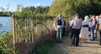 People looking at the new bird hide willow screen at Clophill Lakes