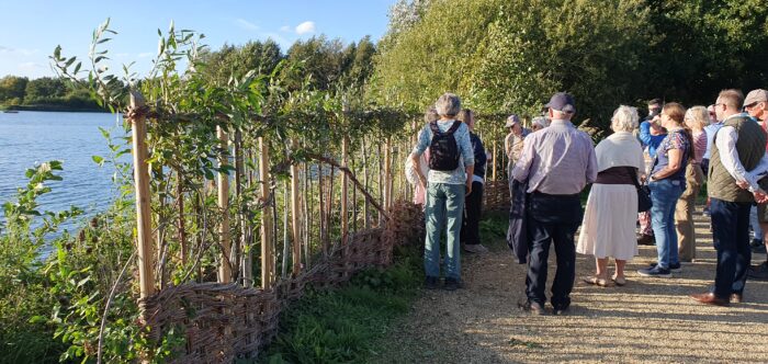 People looking at the new bird hide willow screen at Clophill Lakes
